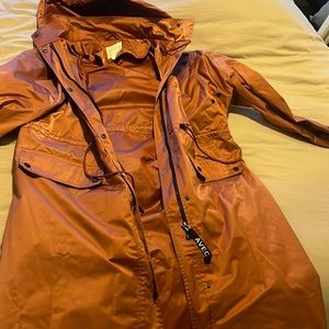 Rust color raincoat size L but fits like a 1X